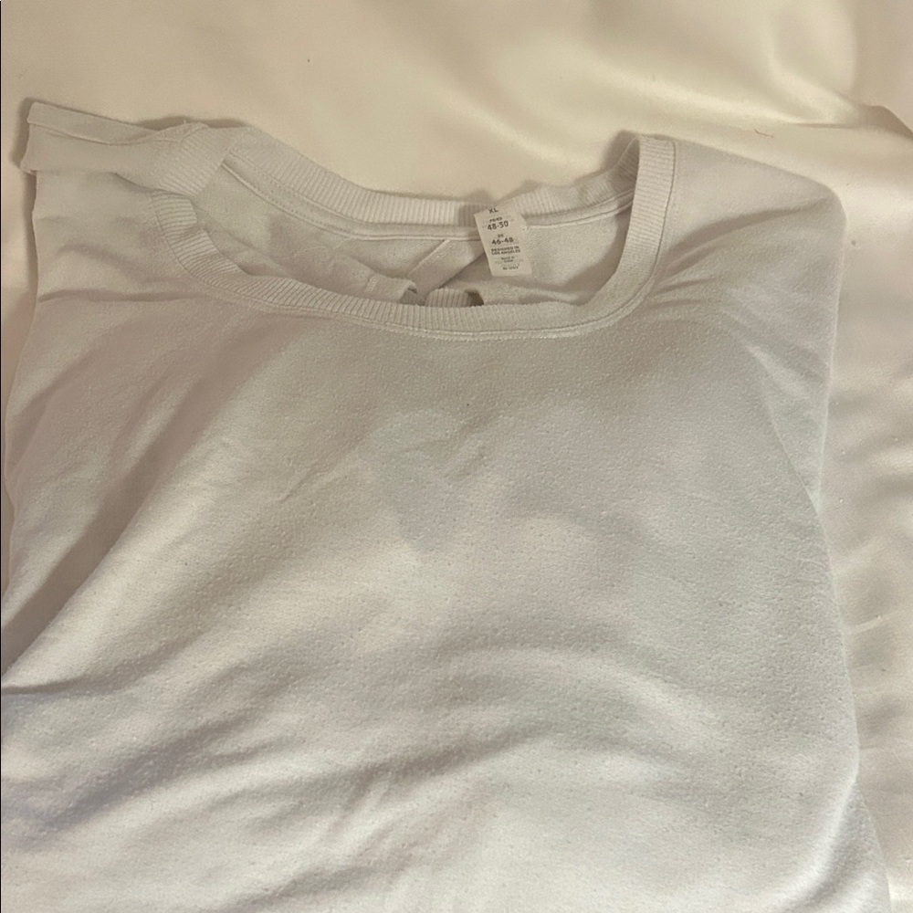 Balance Collection white long sleeve t shirt material. Soft cut out back